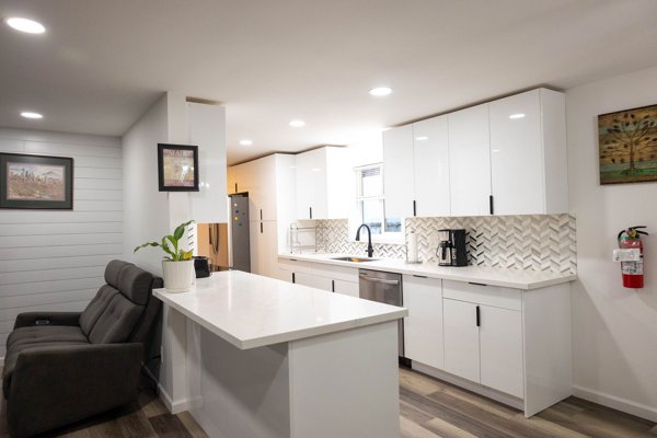Bright kitchen with white cabinetry and island